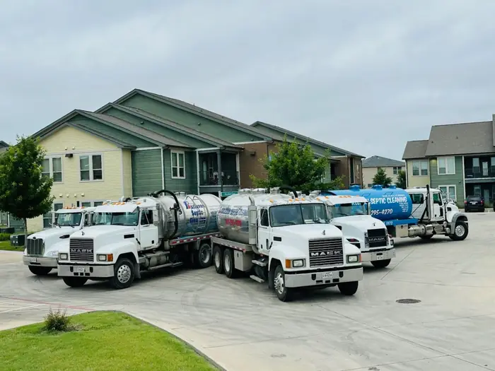 Burleson Septic vacuum trucks staged in a North Texas neighborhood